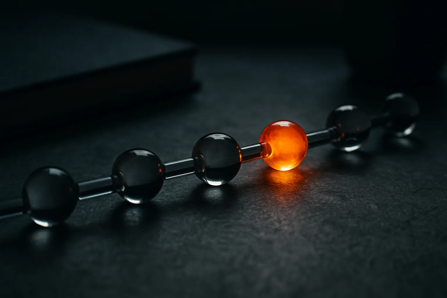 a chain of linked nodes where one link glows a different color while the rest look identical